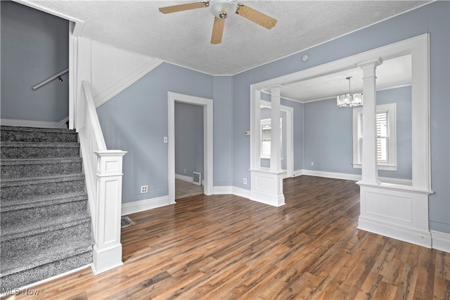 unfurnished living room with a textured ceiling and hardwood / wood-style floors