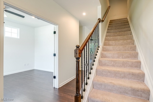 stairway featuring dark hardwood / wood-style floors