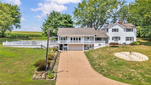 view of front of home with a garage and a front yard