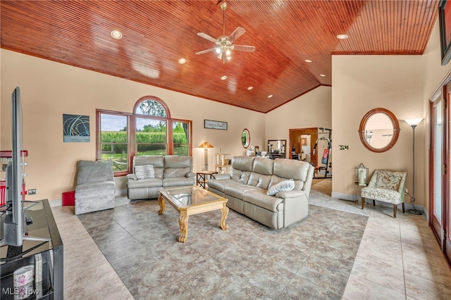 tiled living room featuring ceiling fan, wooden ceiling, and high vaulted ceiling