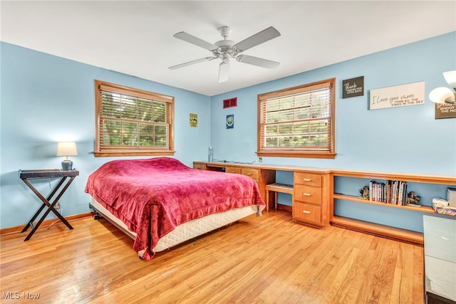 bedroom featuring ceiling fan and light hardwood / wood-style flooring