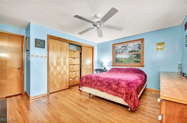 bedroom with light hardwood / wood-style flooring and ceiling fan