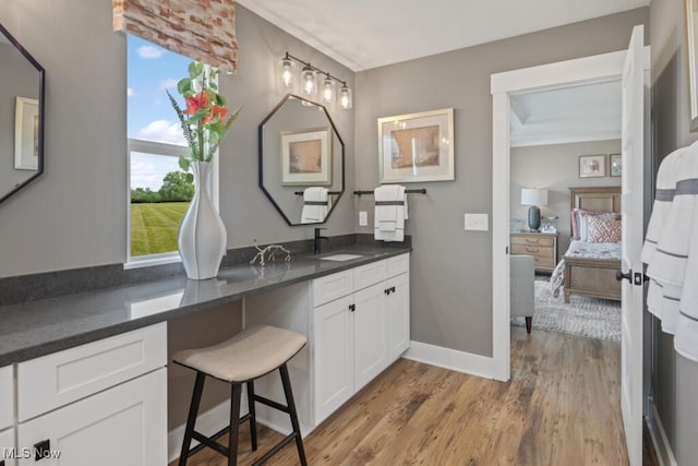 bathroom featuring hardwood / wood-style floors and sink