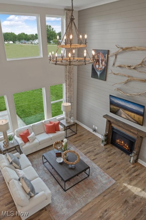 living room with hardwood / wood-style floors and a chandelier