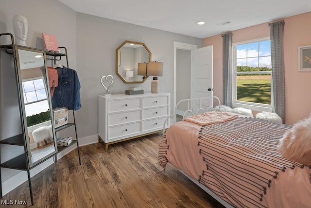 bedroom with hardwood / wood-style floors