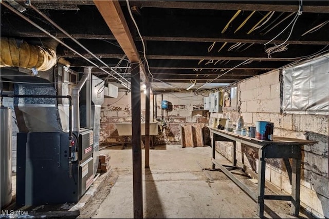 unfinished basement featuring heating unit