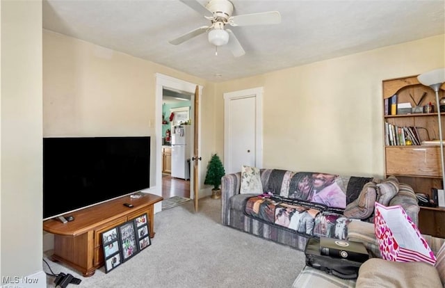 living room with carpet floors and ceiling fan