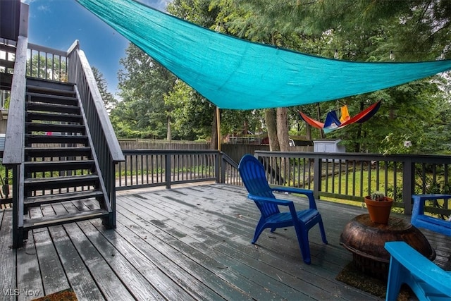 deck with a storage shed