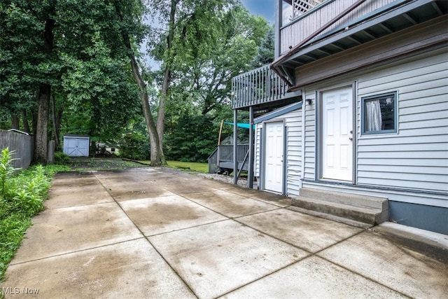 view of patio with a shed