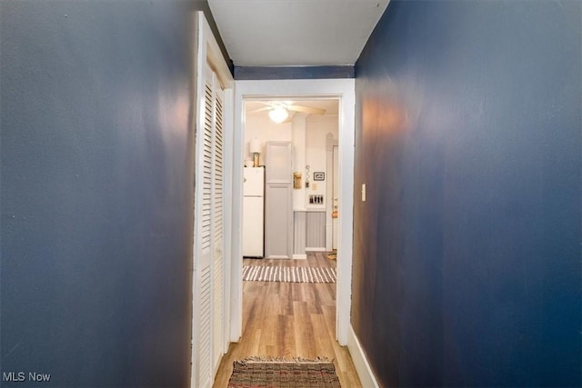 hall with wood finished floors