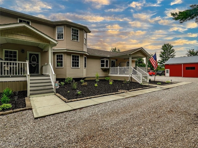 view of front facade featuring an outdoor structure and a porch