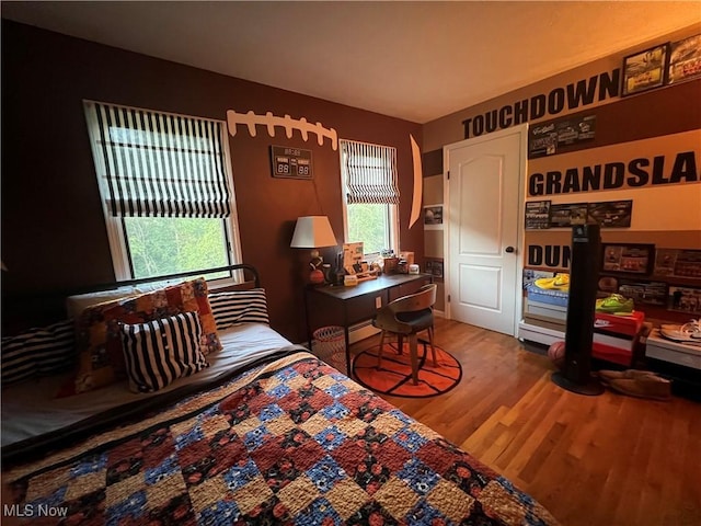 bedroom featuring wood finished floors