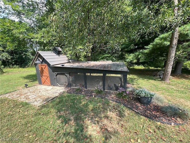 view of poultry coop with a yard