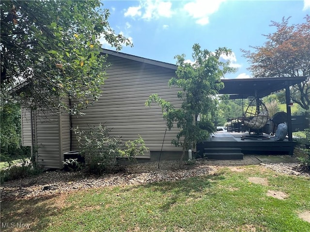 view of property exterior with a yard