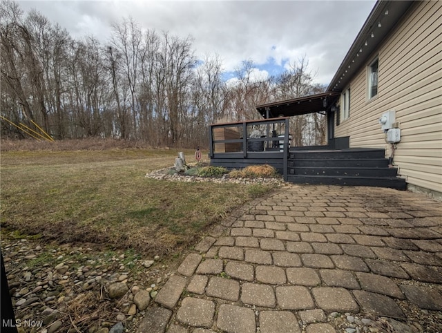 view of yard with a wooden deck