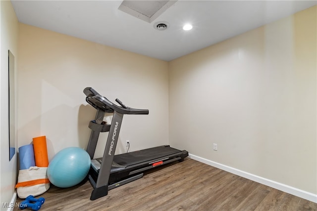 exercise room featuring hardwood / wood-style floors