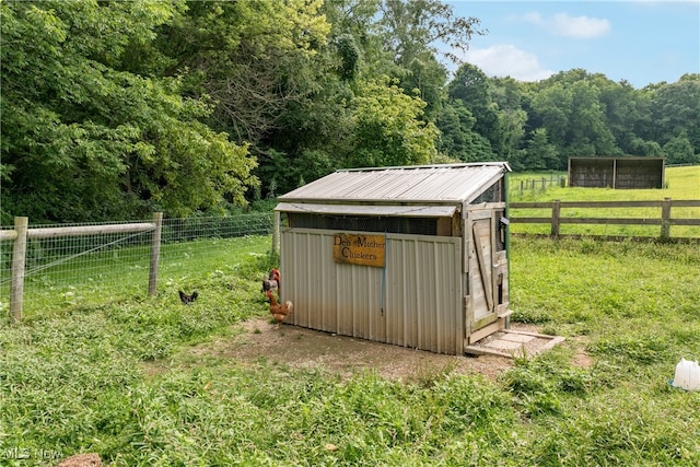 view of outbuilding with a yard