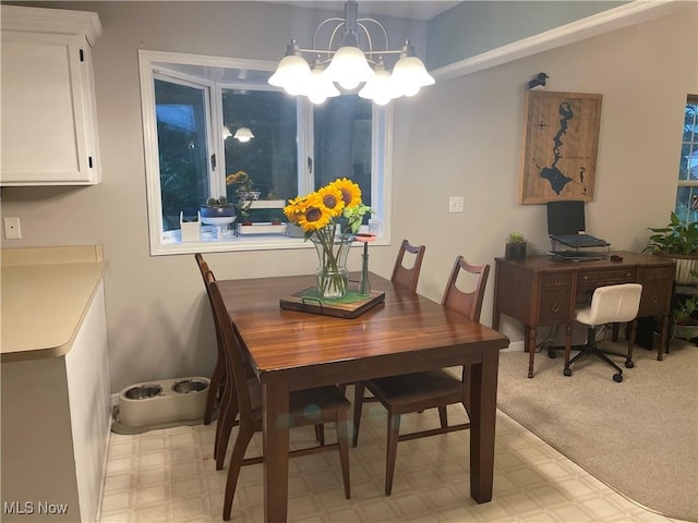 dining room with a notable chandelier