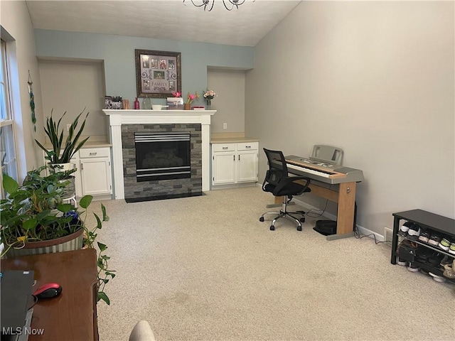 carpeted home office with a fireplace