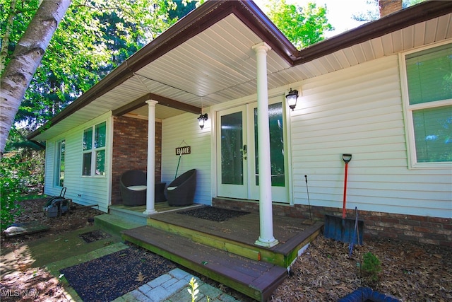 doorway to property featuring a porch