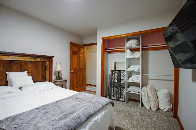 carpeted bedroom featuring a closet