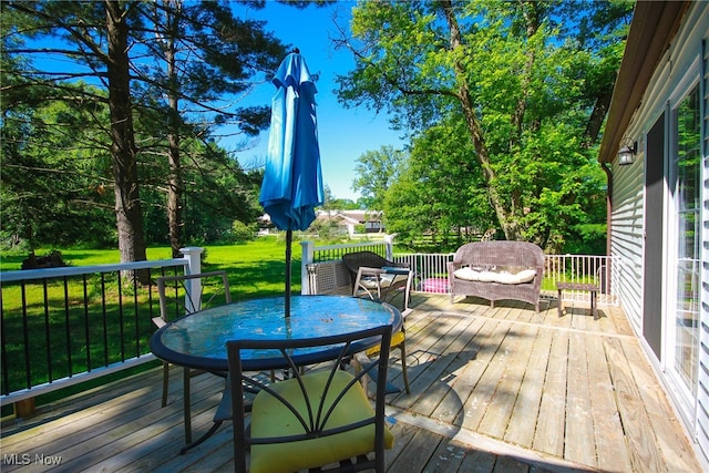 wooden deck with a yard