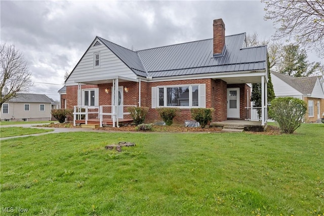 view of front of house with a front yard and covered porch