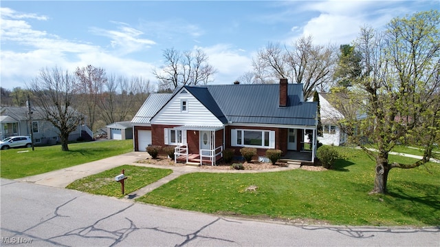 view of front of property featuring a garage and a front yard