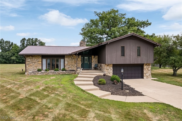 split level home featuring a garage and a front yard