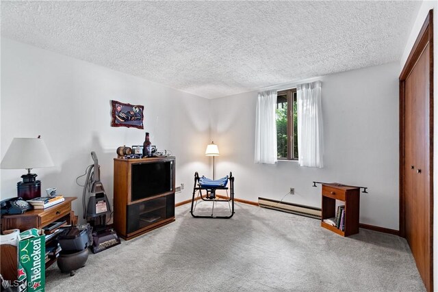 living area with a baseboard radiator, a textured ceiling, and light colored carpet