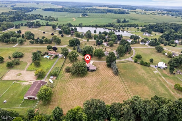 birds eye view of property with a water view and a rural view