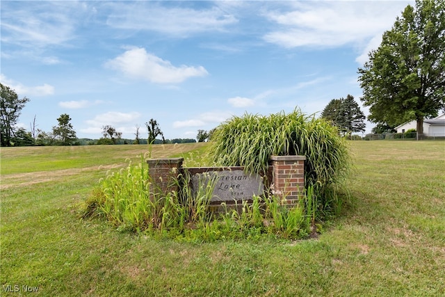 community sign featuring a rural view