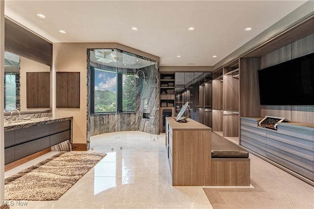 bathroom with vanity and a wealth of natural light