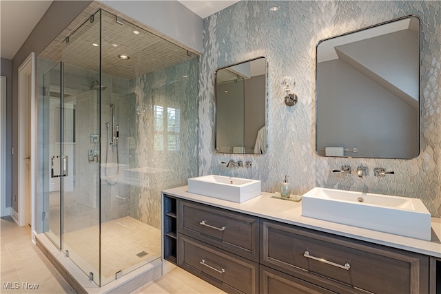 bathroom featuring vanity, walk in shower, and tile patterned floors