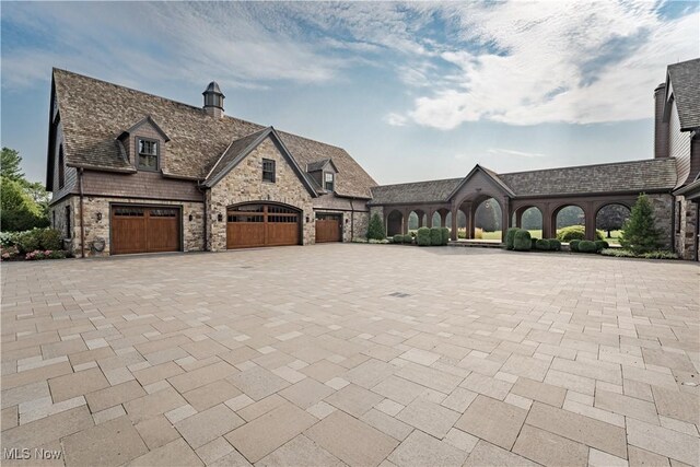 french country home with a garage