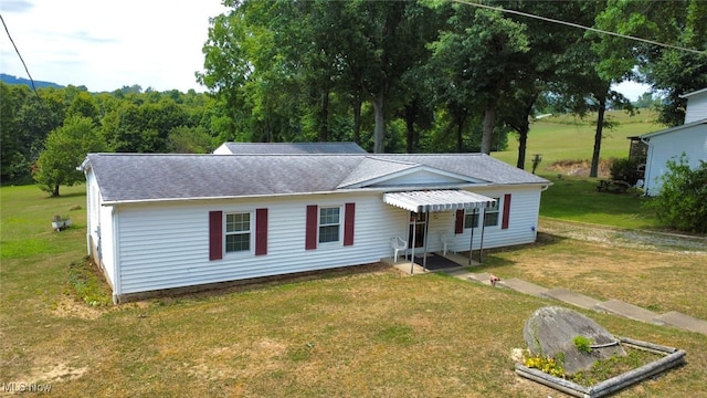 view of front of home with a front yard