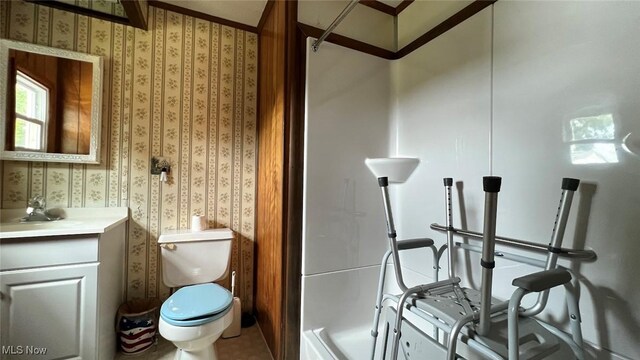 bathroom with tile patterned flooring, toilet, and vanity