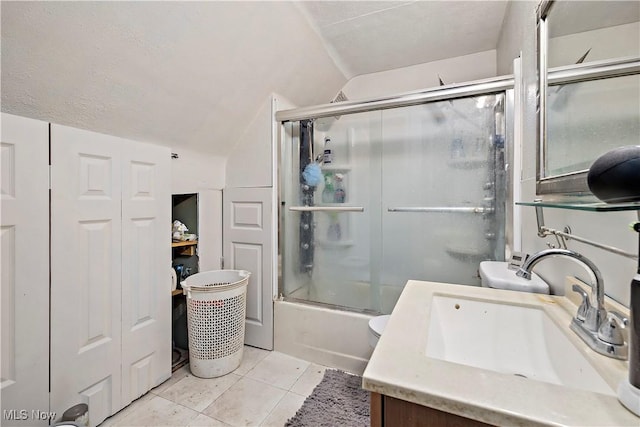 full bathroom featuring tile patterned flooring, a textured ceiling, vaulted ceiling, shower / bath combination with glass door, and vanity