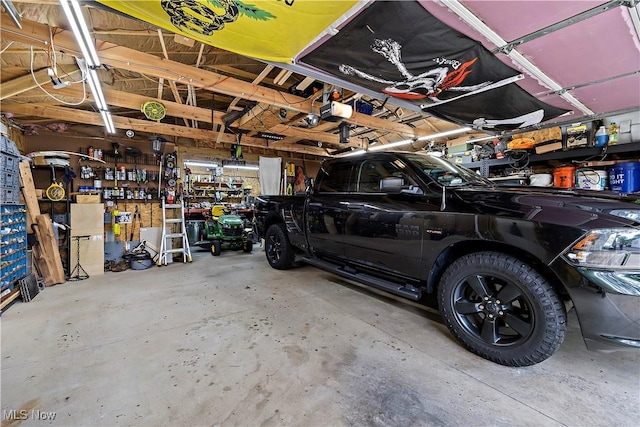 garage featuring a workshop area and a garage door opener