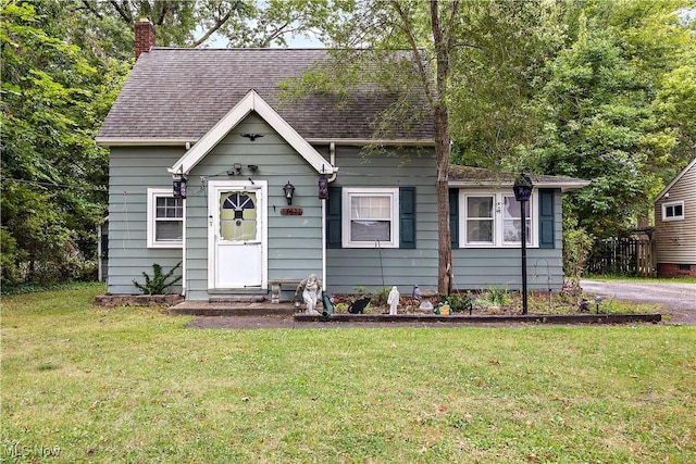 bungalow with a front yard