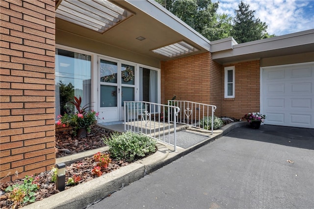 doorway to property featuring a garage