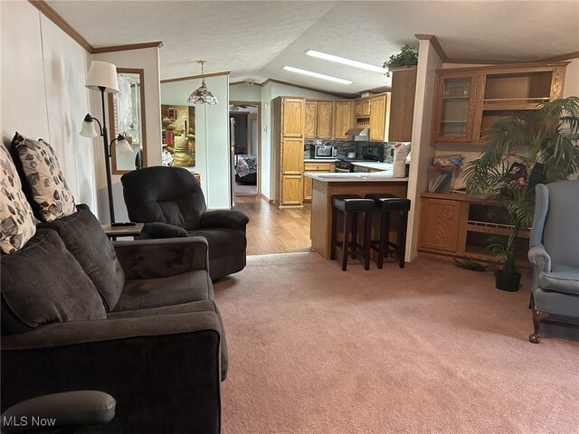 carpeted living room featuring vaulted ceiling, crown molding, and a textured ceiling