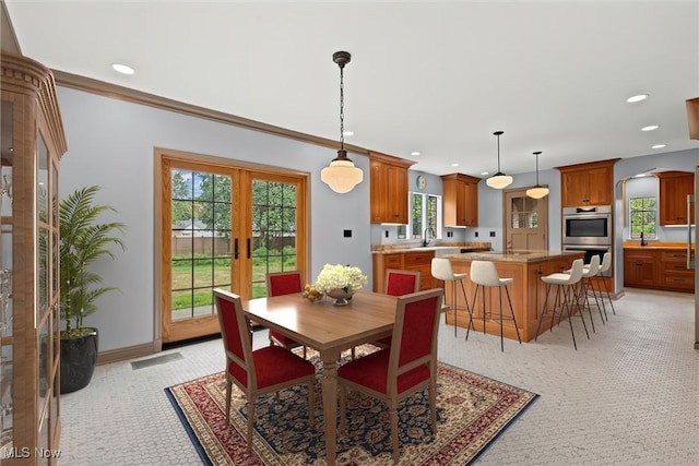 dining room featuring ornamental molding, recessed lighting, french doors, and baseboards