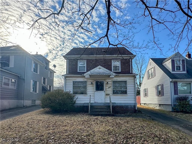 view of front of property featuring brick siding