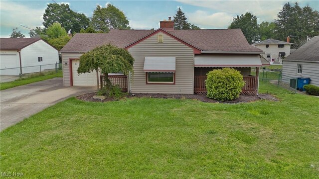 bungalow featuring a garage and a front yard