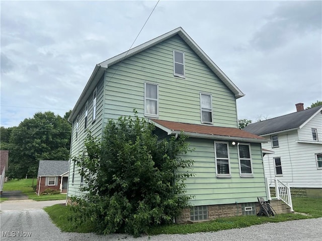 view of property exterior with entry steps