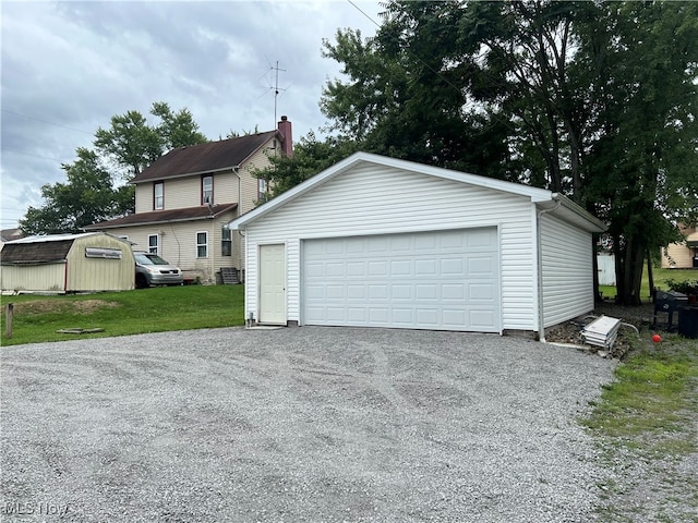 garage featuring a lawn