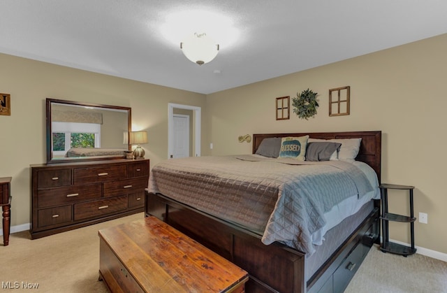 bedroom featuring light colored carpet