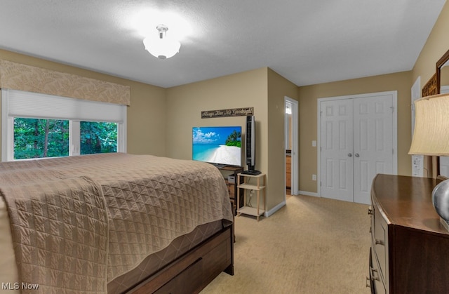 carpeted bedroom with a closet