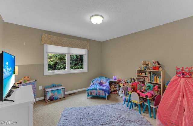 playroom featuring light carpet